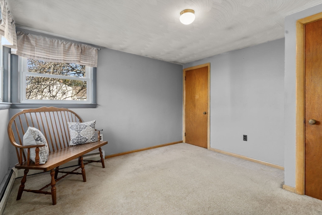 30 Wampum Avenue Waltham, MA 02451 - Photo 21 of 29 a view of an empty room with a window and a bathroom