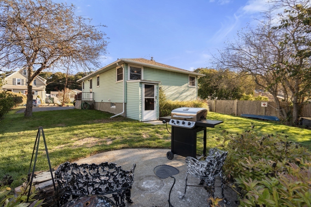 30 Wampum Avenue Waltham, MA 02451 - Photo 24 of 29 a front view of a house with garden