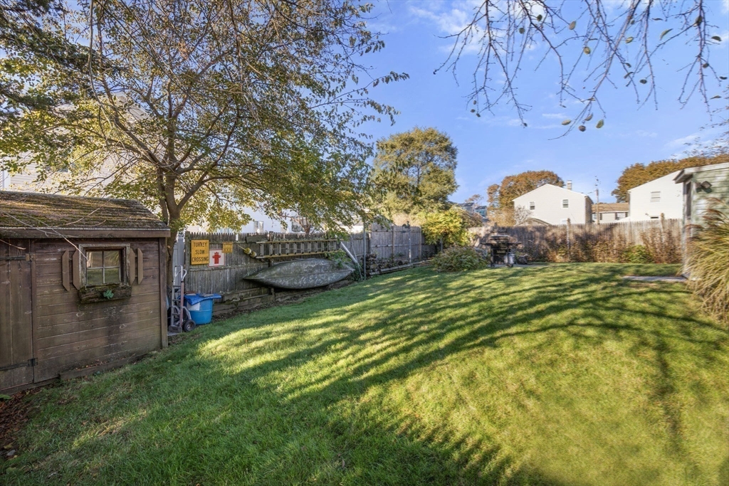 30 Wampum Avenue Waltham, MA 02451 - Photo 26 of 29 a front view of a house with garden