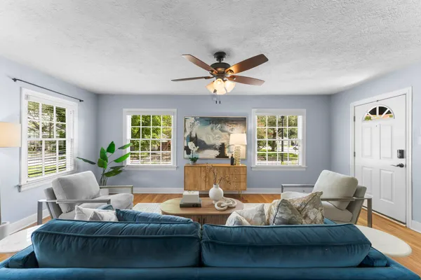 a living room with furniture and a large window