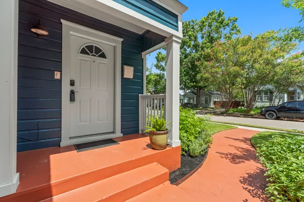 a view of a bench in front of a house