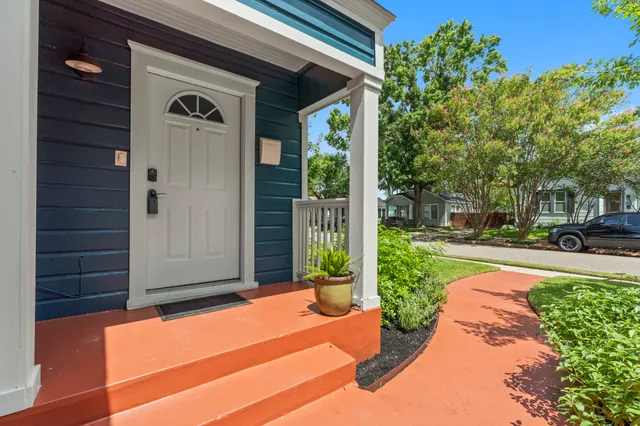a view of a bench in front of a house