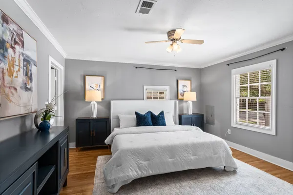 a bedroom with a large bed and a window