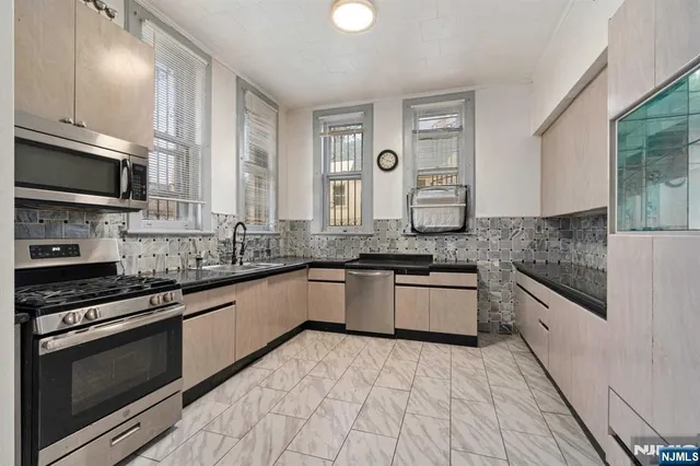 a view of a hallway with closet and entryway