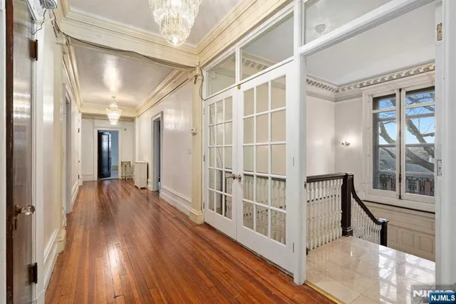 a bathroom with a double vanity sink a mirror and a shower