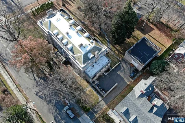a view of swimming pool with sitting area