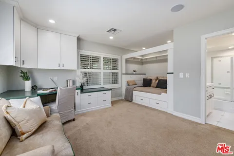 a kitchen with furniture and window