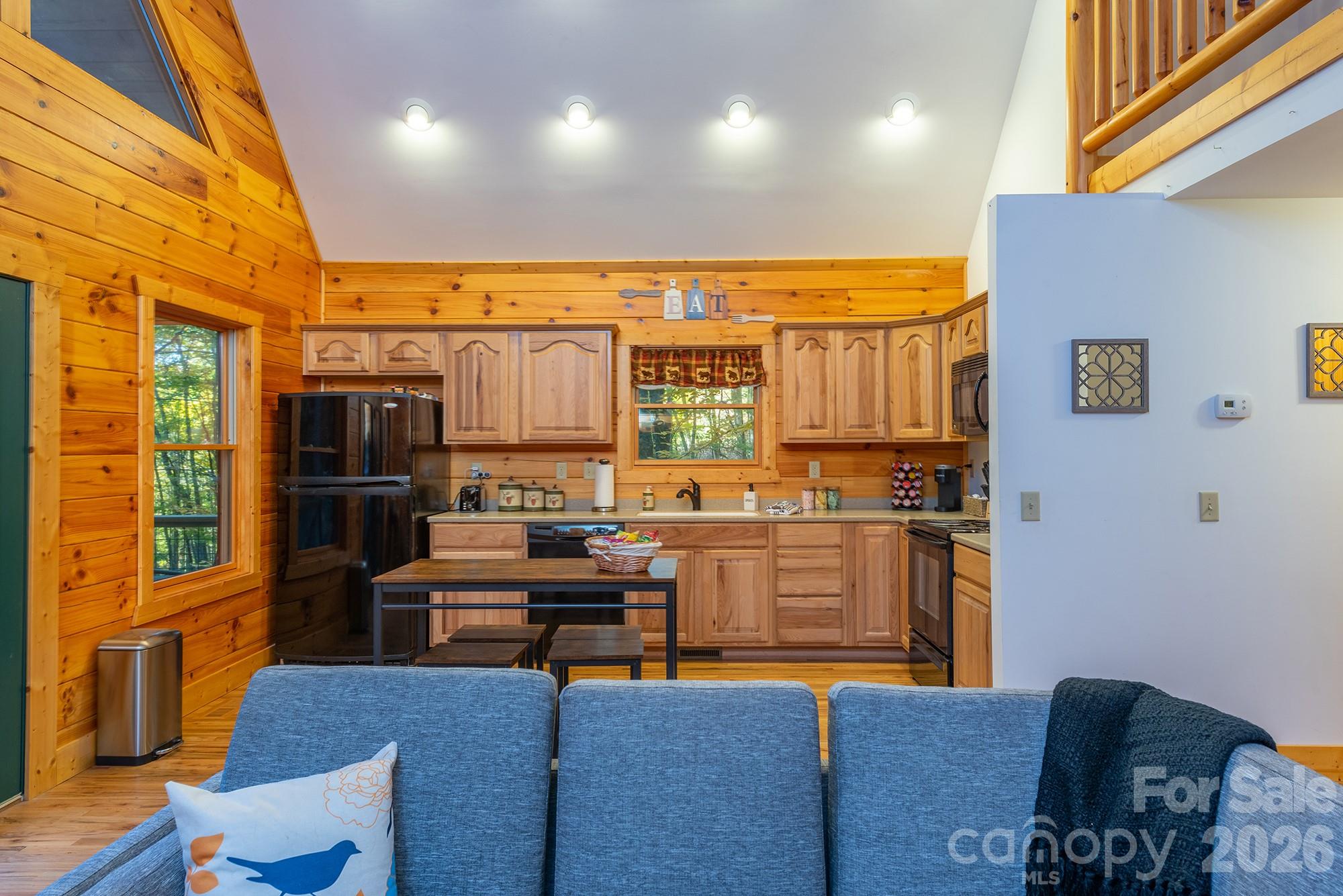 100 Candlemaker Trail Maggie Valley, NC 28751 - Photo 11 of 34 a view of a living room with furniture and kitchen view