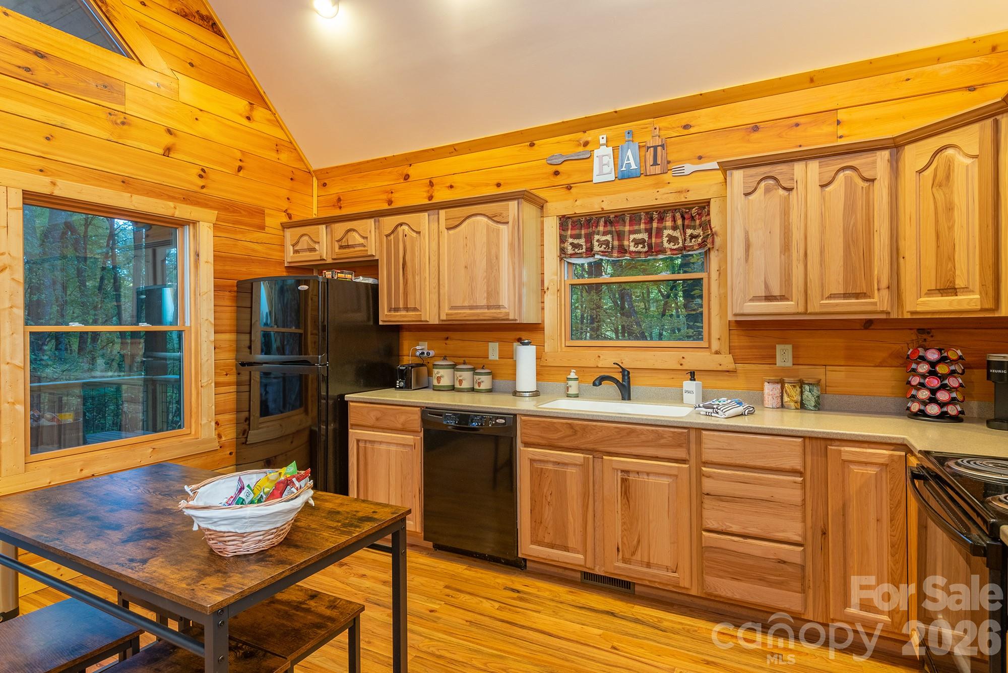 100 Candlemaker Trail Maggie Valley, NC 28751 - Photo 13 of 34 a kitchen with a sink stove and refrigerator
