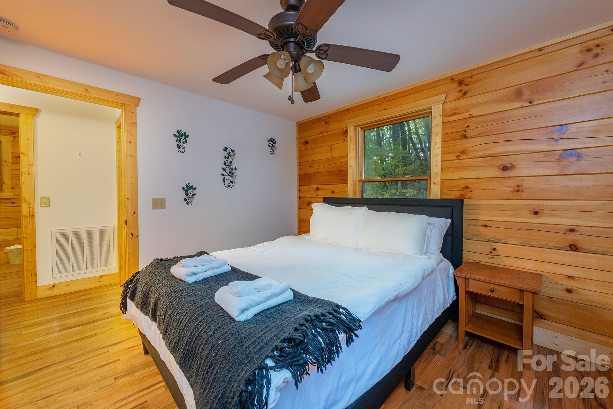 100 Candlemaker Trail Maggie Valley, NC 28751 - Photo 16 of 34 a bedroom with a bed and a window