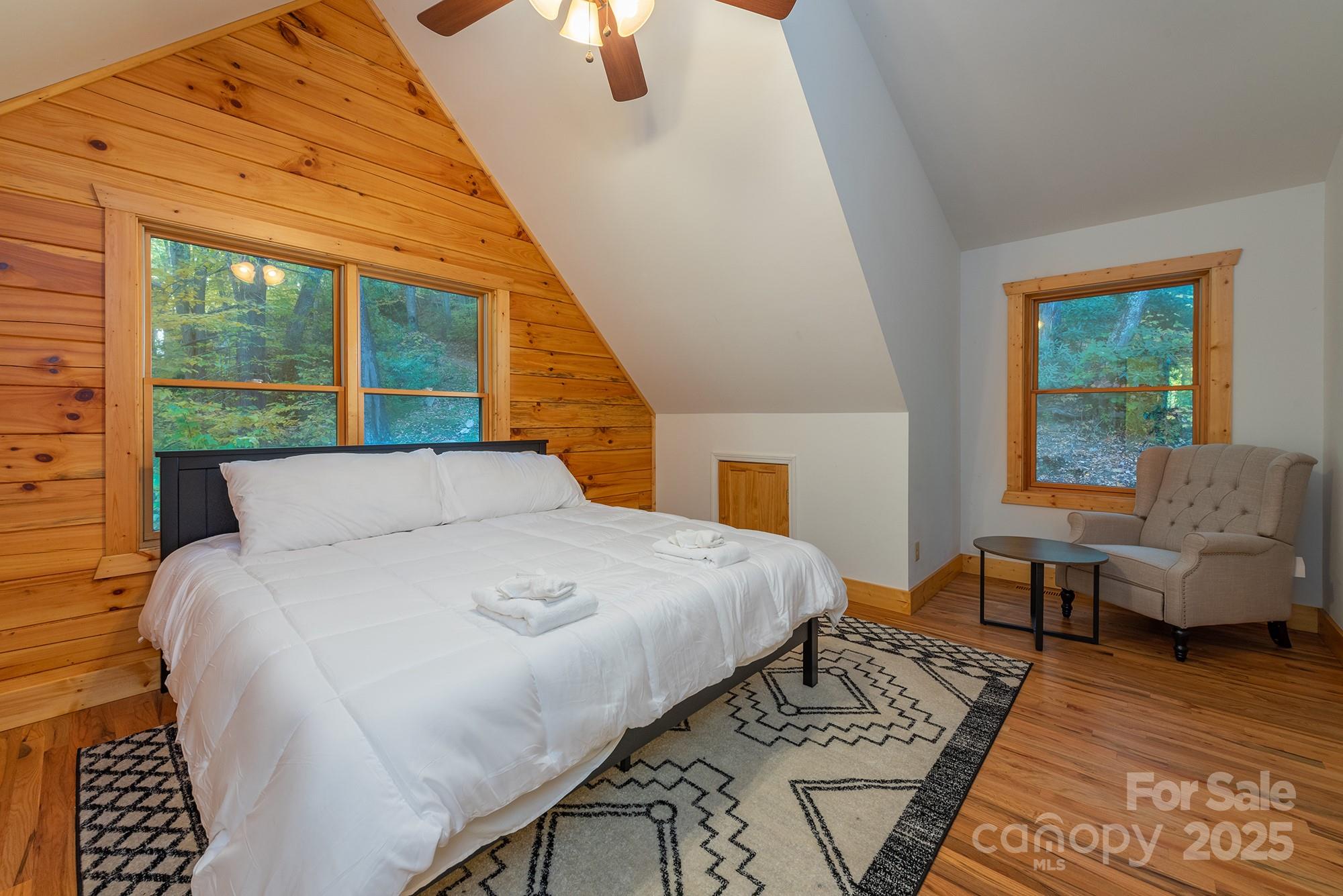 100 Candlemaker Trail Maggie Valley, NC 28751 - Photo 20 of 34 a large bed sitting in a bedroom next to a window