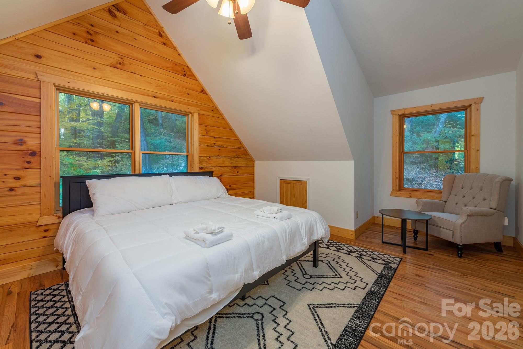 100 Candlemaker Trail Maggie Valley, NC 28751 - Photo 21 of 34 a large bed sitting in a bedroom next to a window