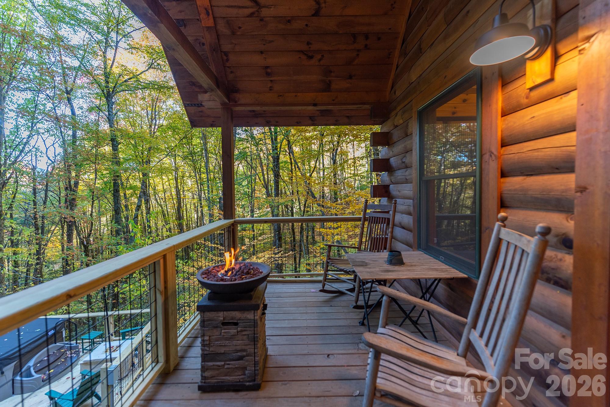 100 Candlemaker Trail Maggie Valley, NC 28751 - Photo 23 of 34 a view of a chairs and table in the balcony
