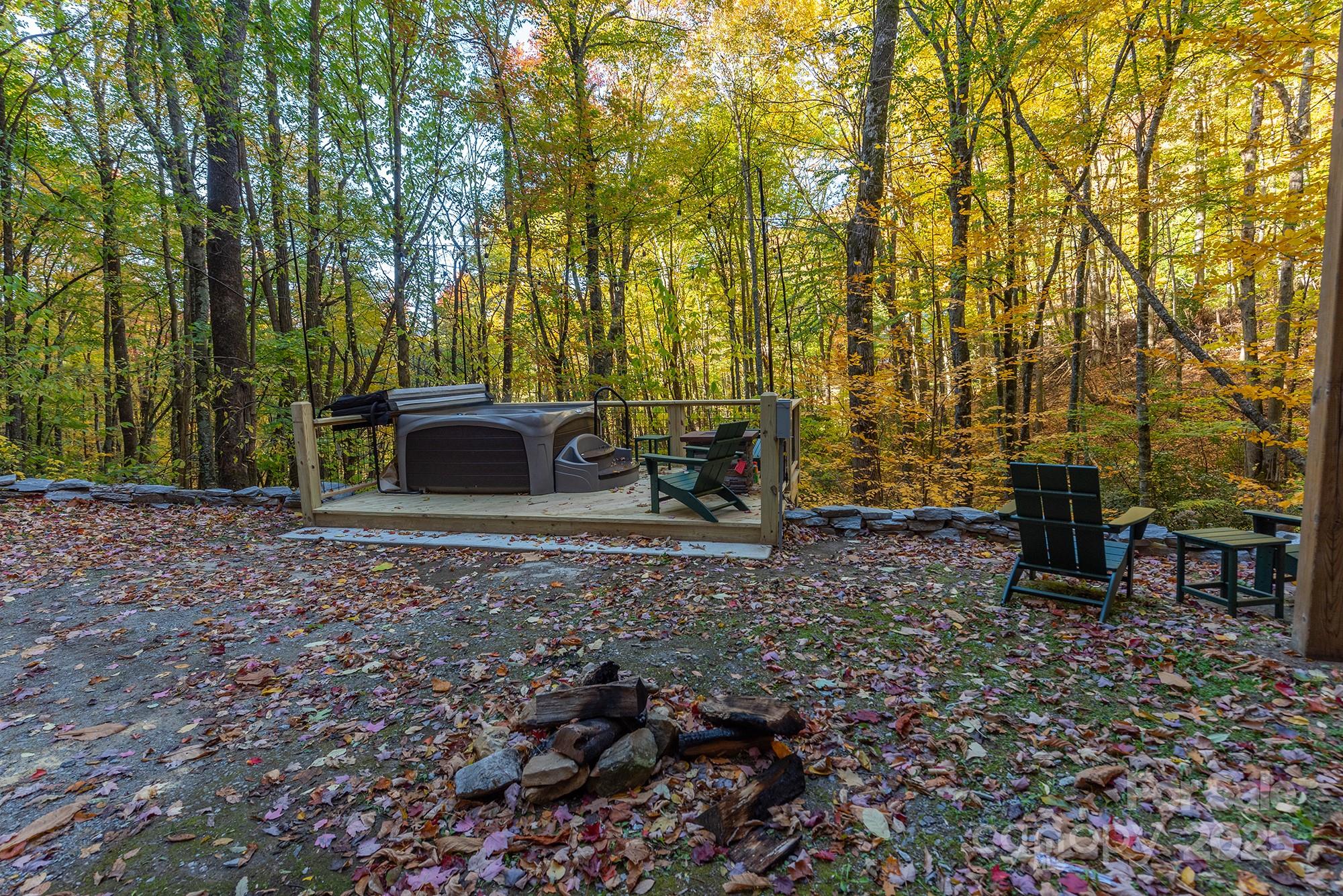 100 Candlemaker Trail Maggie Valley, NC 28751 - Photo 23 of 34 a view of a backyard with table and chairs