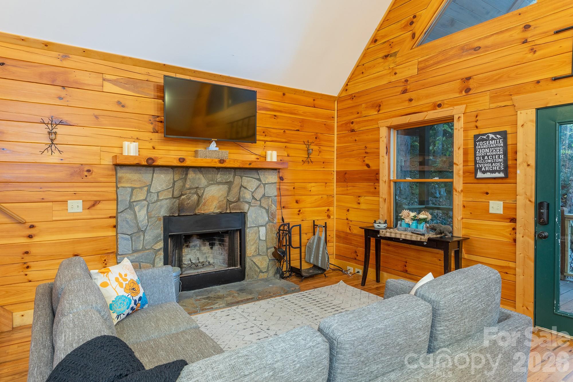 100 Candlemaker Trail Maggie Valley, NC 28751 - Photo 4 of 34 a living room with furniture and a fireplace