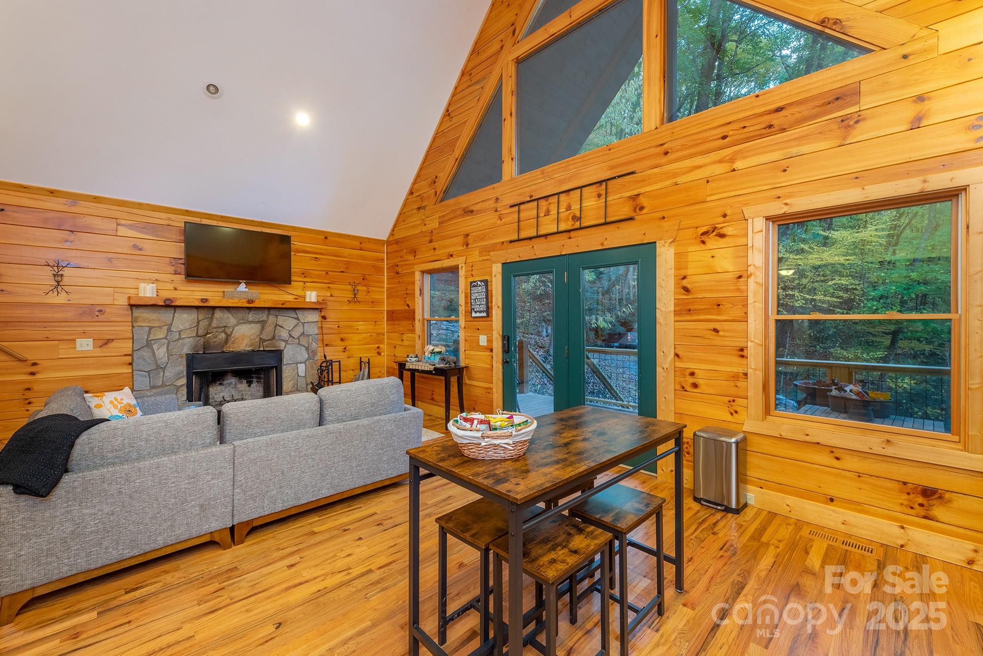 100 Candlemaker Trail Maggie Valley, NC 28751 - Photo 5 of 34 a view of a patio with a table and chairs