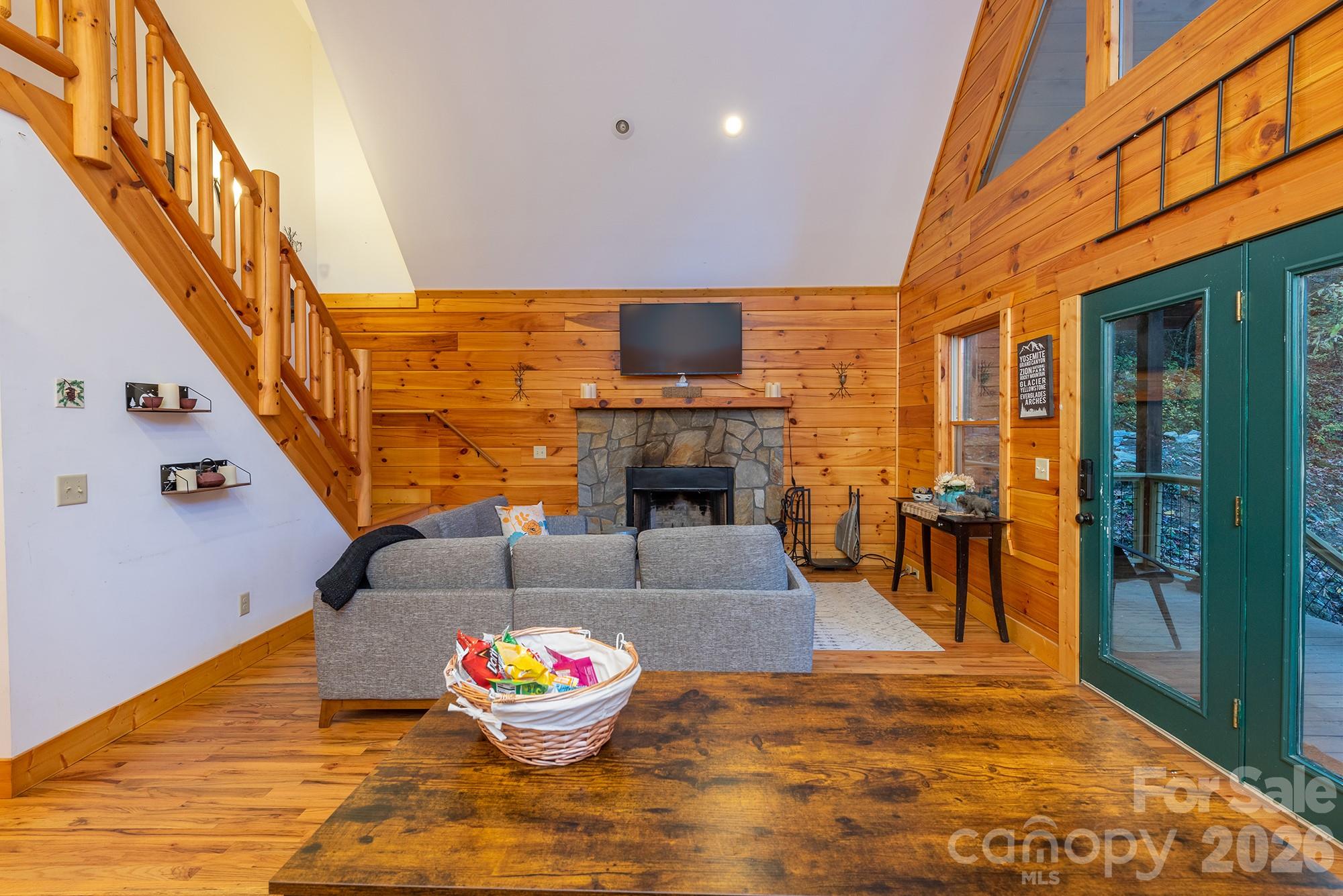 100 Candlemaker Trail Maggie Valley, NC 28751 - Photo 8 of 34 a living room with fireplace furniture and a wooden floor
