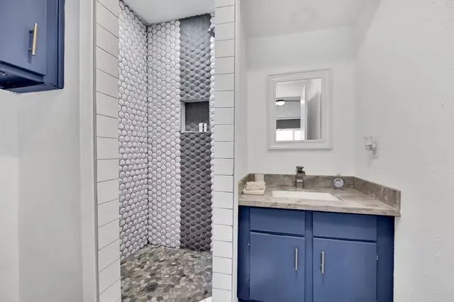 a bathroom with a sink and a mirror