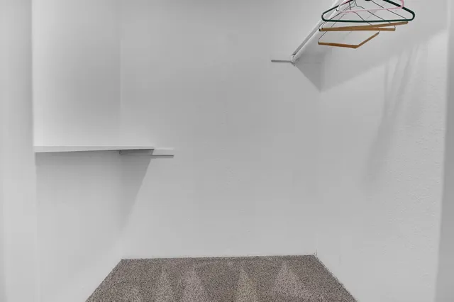 a view of a room with rack on the wall