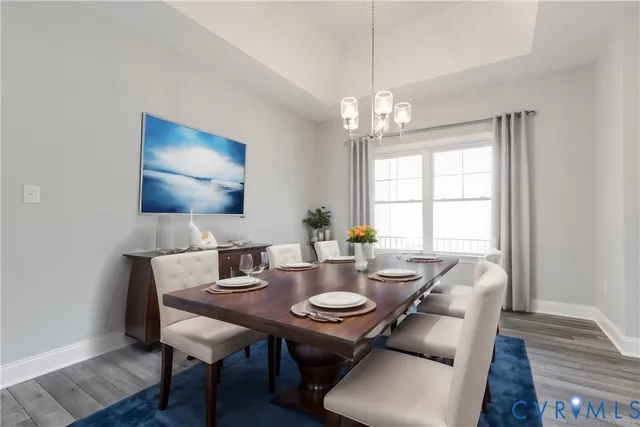 a view of a dining room with furniture and window