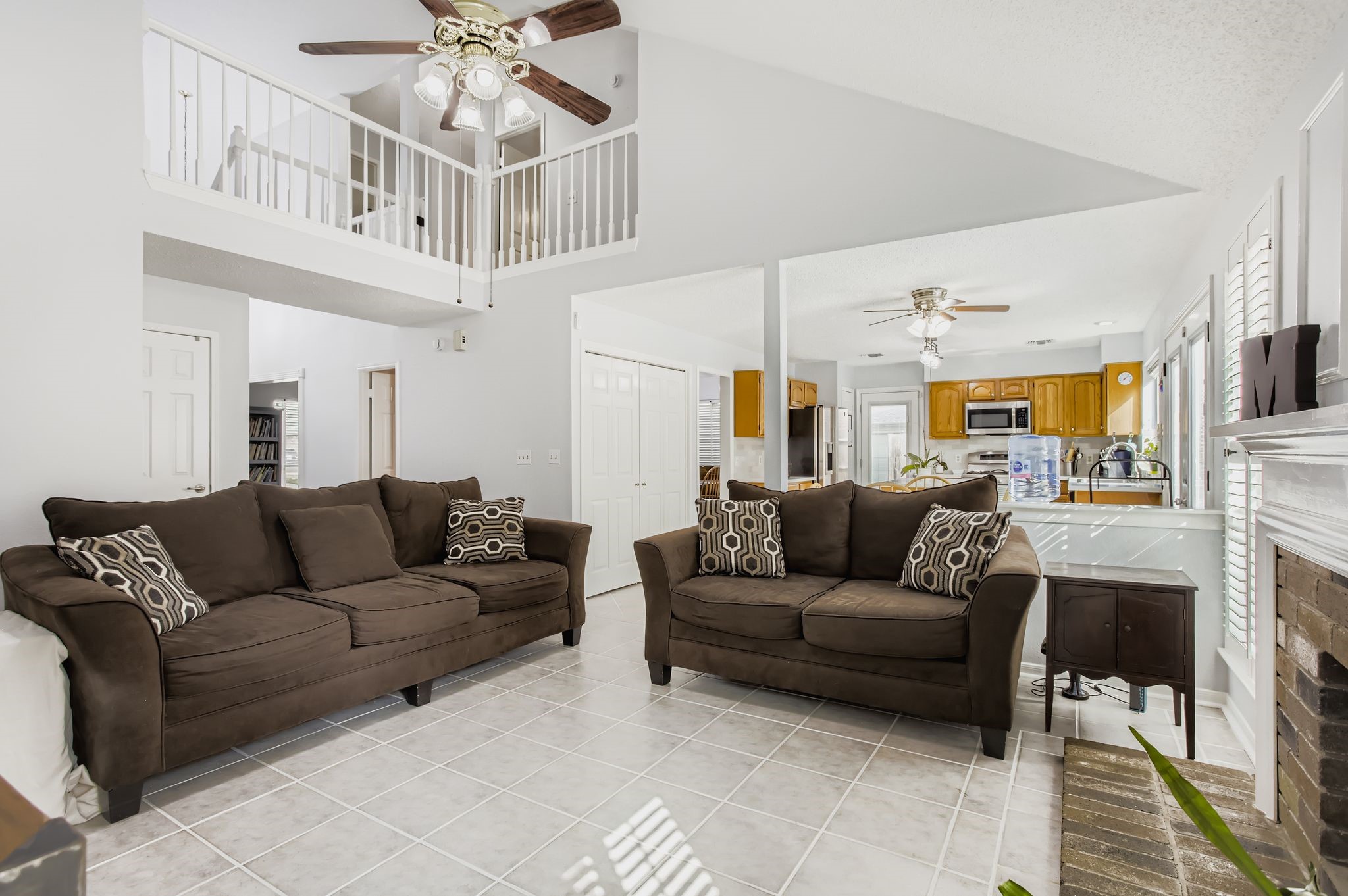 7530 Dogwood Falls Road Houston, TX 77095 - Photo 11 of 27 The family room is open to the kitchen, and the vaulted ceilings open it up to the second floor with a loft and cat walk.