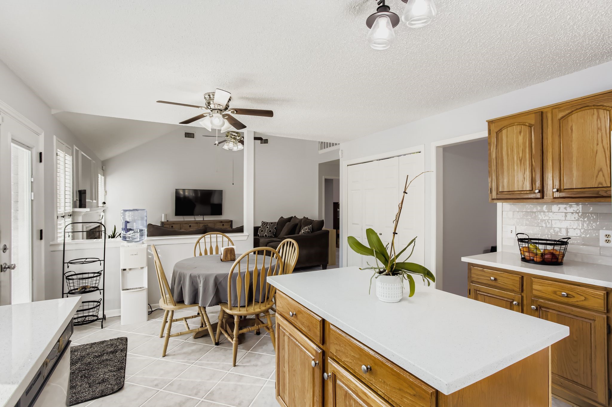 7530 Dogwood Falls Road Houston, TX 77095 - Photo 13 of 27 The kitchen offers a cozy nook with ceiling fan.