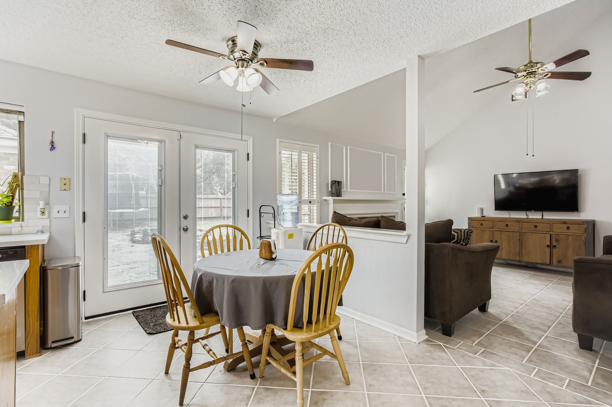 7530 Dogwood Falls Road Houston, TX 77095 - Photo 15 of 27 While entertaining guests on nice weather days you can open up these custom double doors and let the party spill out onto the flagstone patio.