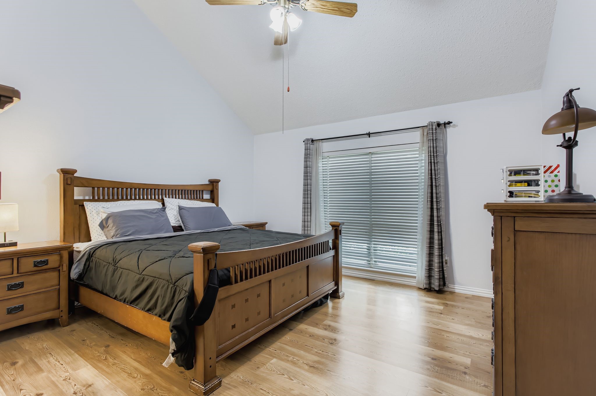 7530 Dogwood Falls Road Houston, TX 77095 - Photo 17 of 27 The primary bedroom is on the first floor and has more of that stunning wood laminate flooring.