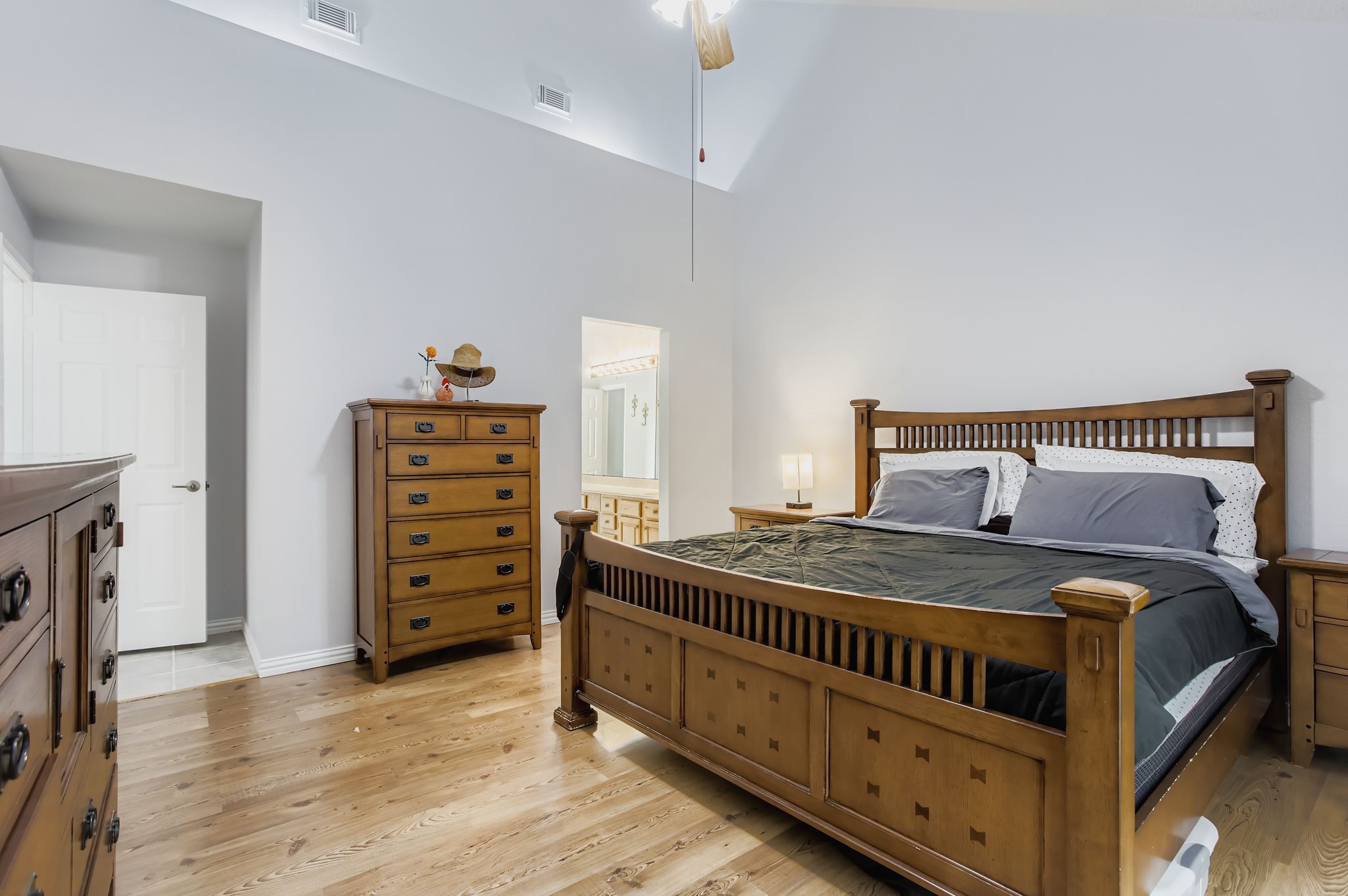 7530 Dogwood Falls Road Houston, TX 77095 - Photo 18 of 27 The primary bedroom also offers a vaulted ceiling with some custom lighting and plenty of space.