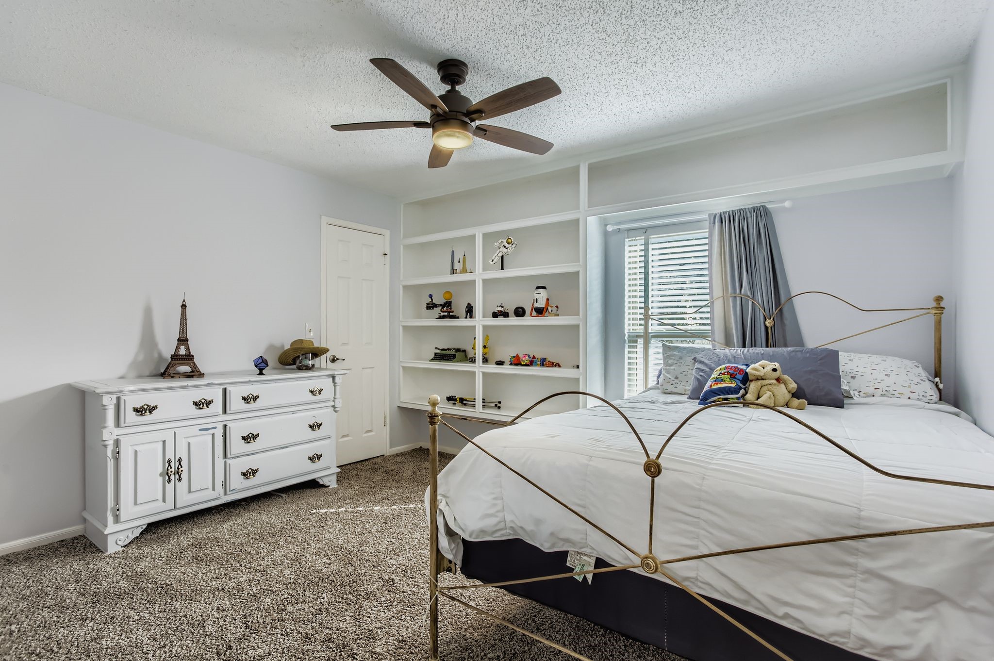 7530 Dogwood Falls Road Houston, TX 77095 - Photo 21 of 27 Secondary bedroom #1 offers a modern remote control ceiling fan and walk-in closet.
