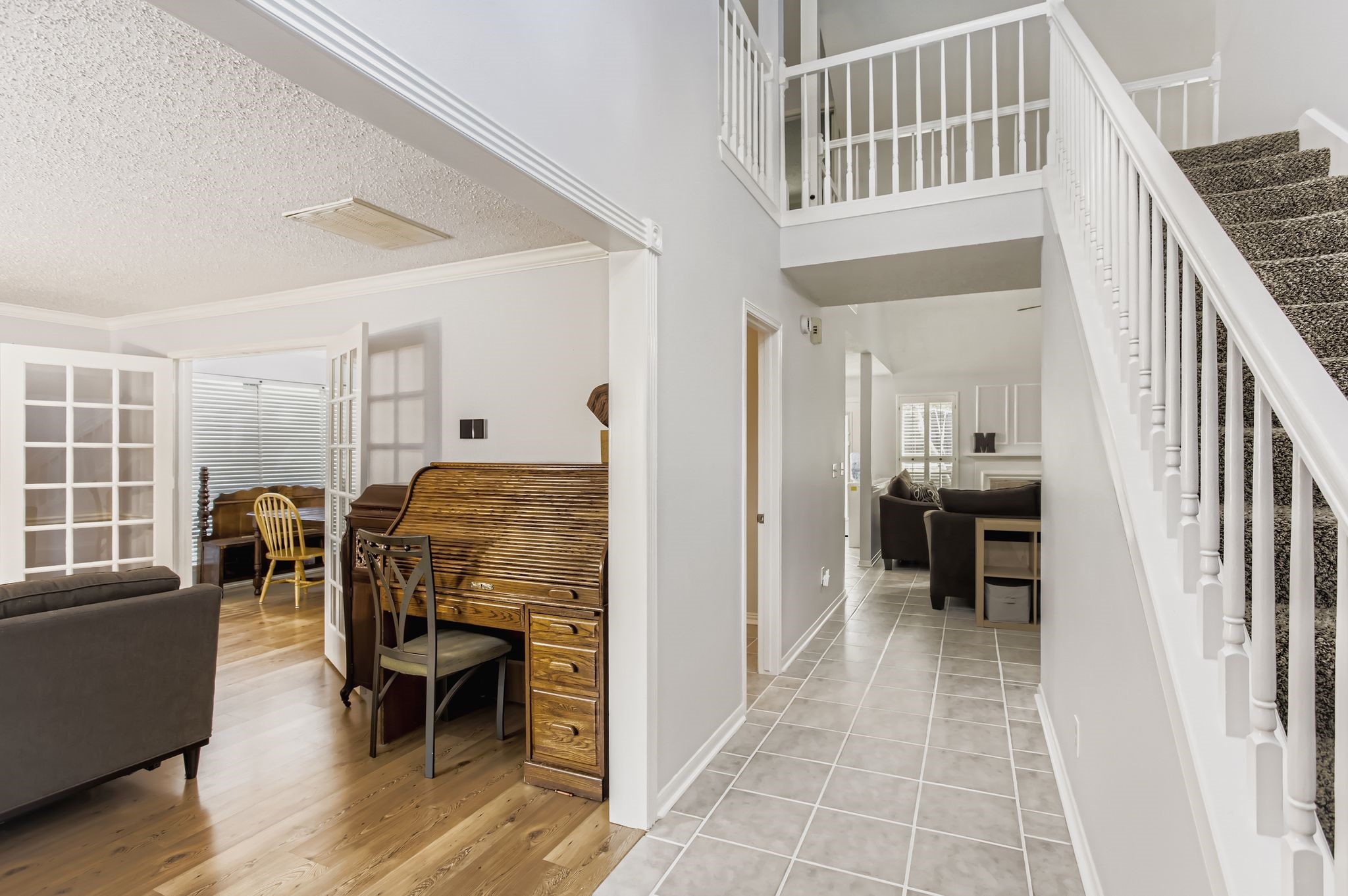 7530 Dogwood Falls Road Houston, TX 77095 - Photo 5 of 27 The tile entry transitions to a beautiful wood laminate floor as you ente the formal living room.
