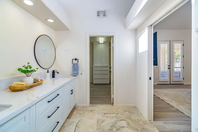 a living room with furniture flowerpot and a potted plant