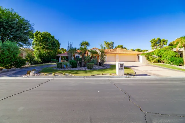 a en suite bathroom with a toilet sink and mirror