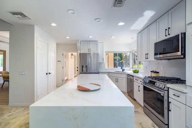 a view of wooden floor and windows in a room
