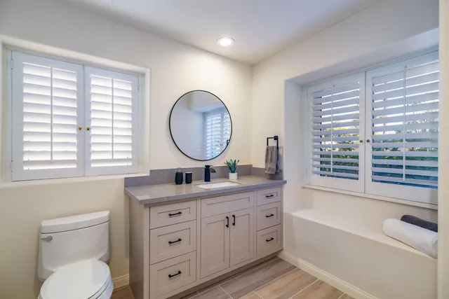 a view of room with window and hardwood floor