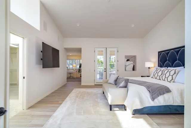 a bedroom with a bed and a chair