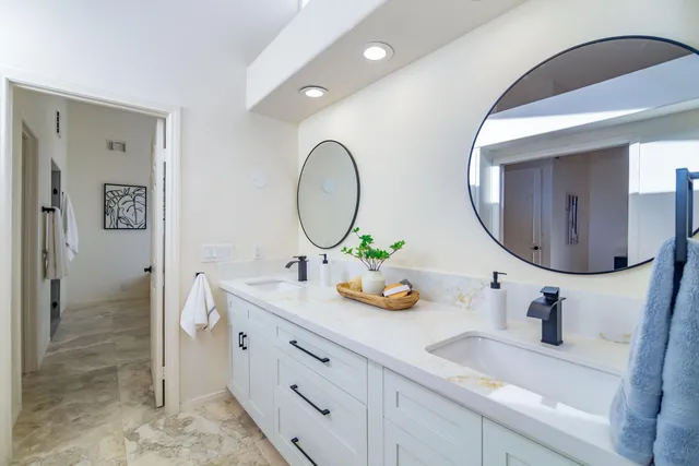 a utility room with sink dryer and washer
