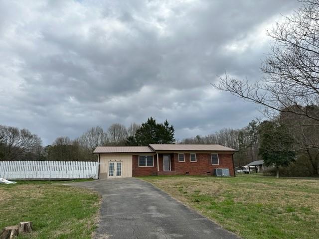 a view of a house with a big yard next to a yard