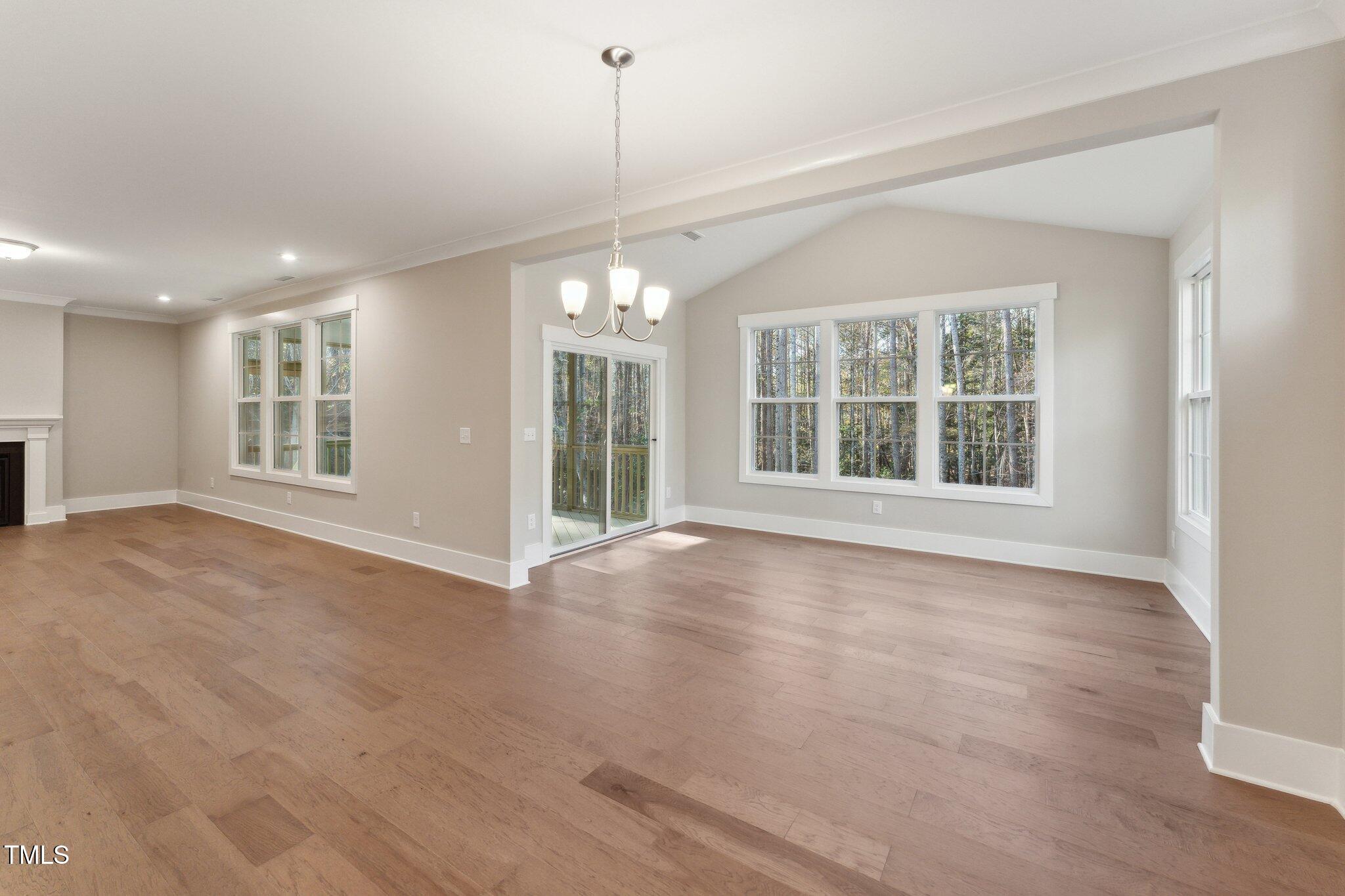 237 Dona Drive Carthage, NC 28327 - Photo 12 of 39 a view of an empty room with a window and wooden floor