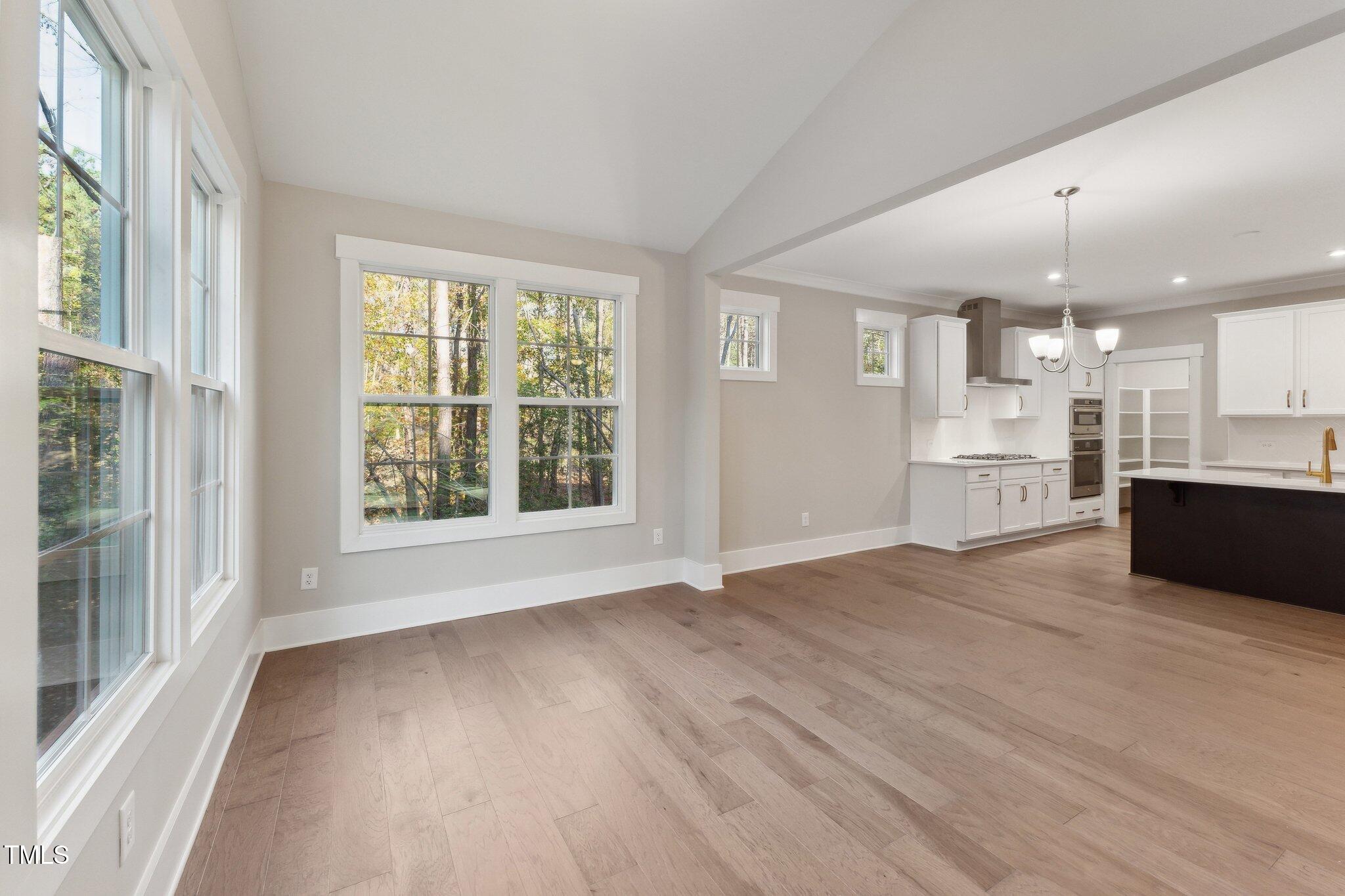 237 Dona Drive Carthage, NC 28327 - Photo 17 of 39 a view of kitchen with wooden floor and windows