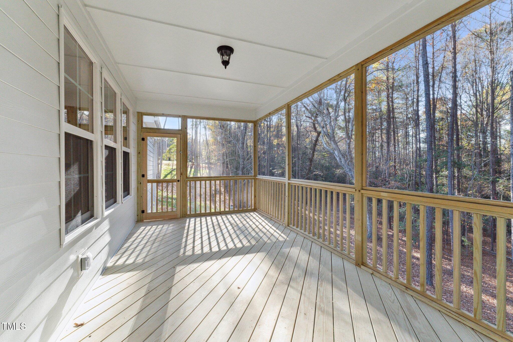 237 Dona Drive Carthage, NC 28327 - Photo 22 of 39 a view of a porch with wooden floor