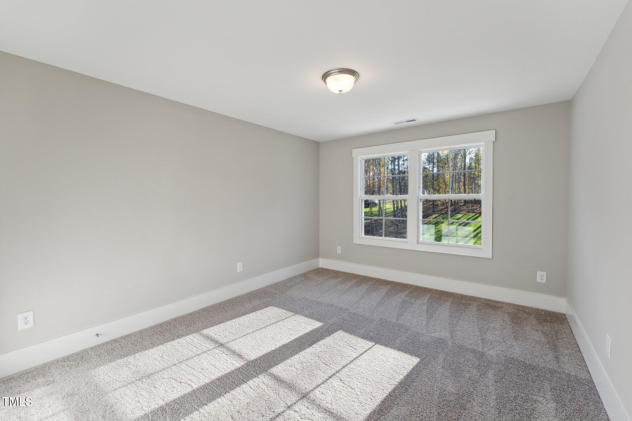 237 Dona Drive Carthage, NC 28327 - Photo 24 of 39 an empty room with windows