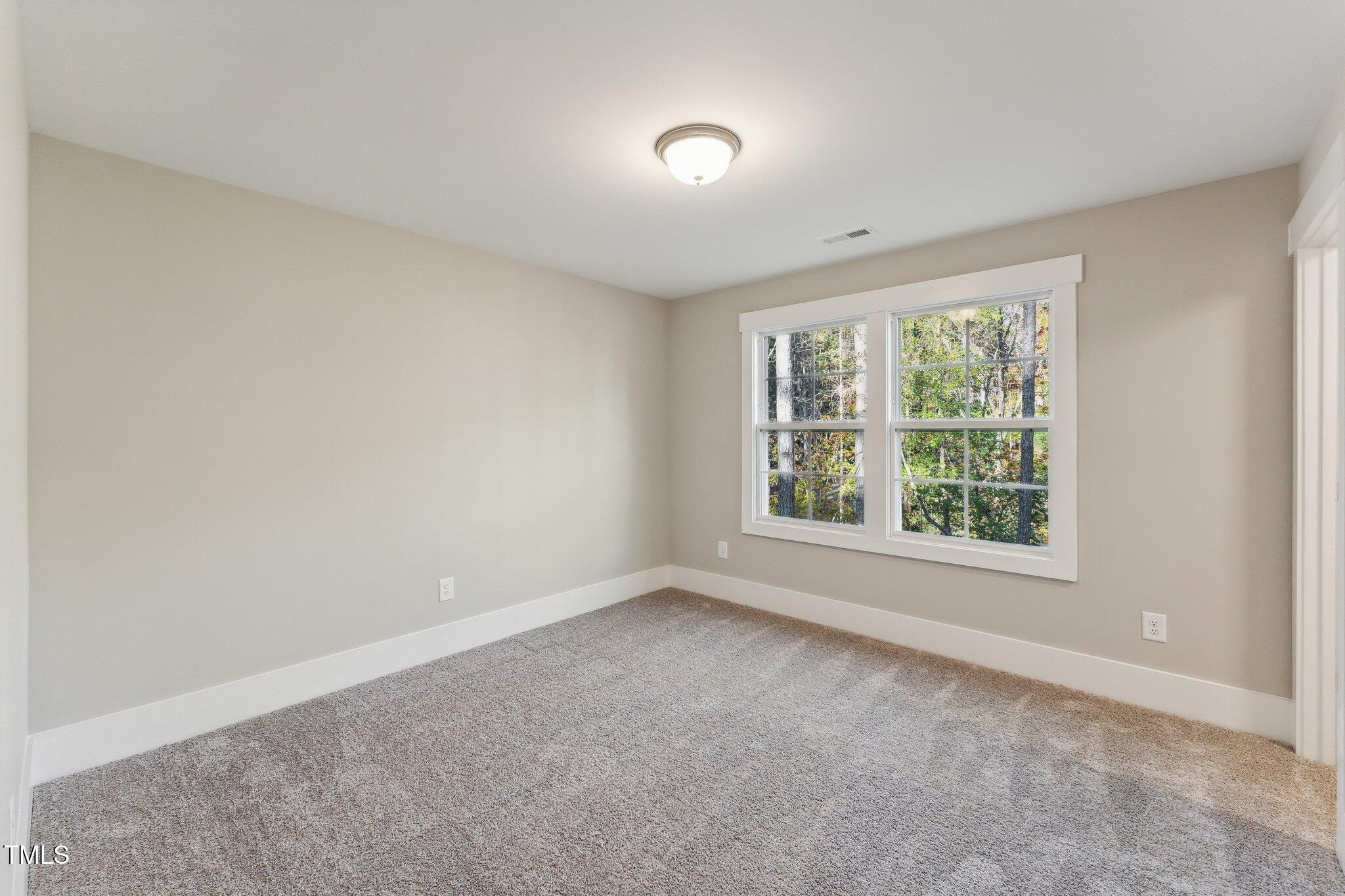 237 Dona Drive Carthage, NC 28327 - Photo 26 of 39 an empty room with a window