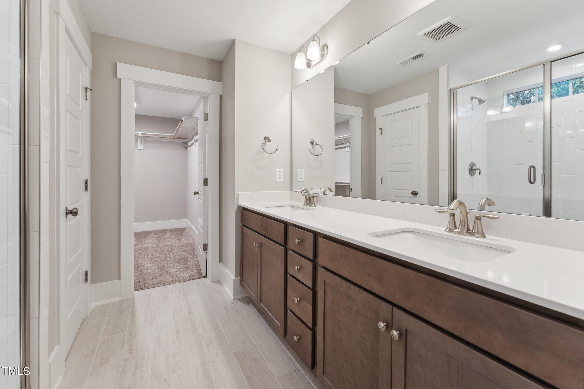 237 Dona Drive Carthage, NC 28327 - Photo 30 of 39 a bathroom with a double vanity sink mirror double and shower