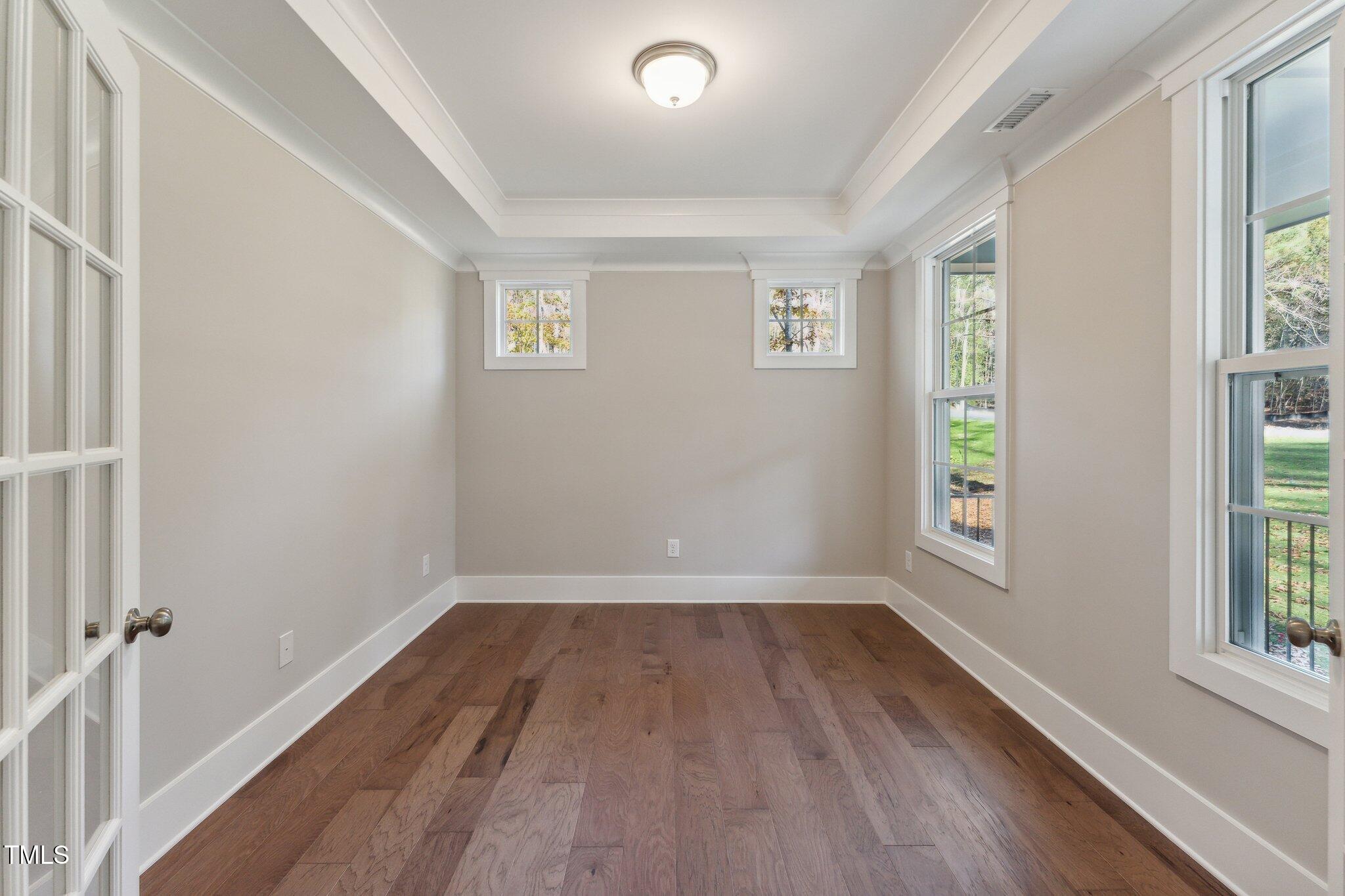 237 Dona Drive Carthage, NC 28327 - Photo 3 of 39 wooden floor in an empty room with a window