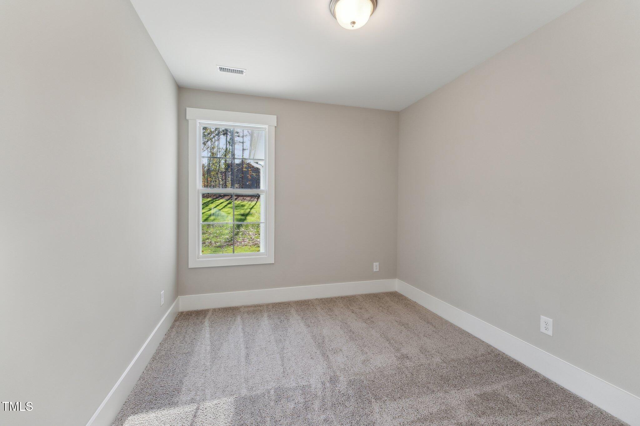 237 Dona Drive Carthage, NC 28327 - Photo 5 of 39 an empty room with a window