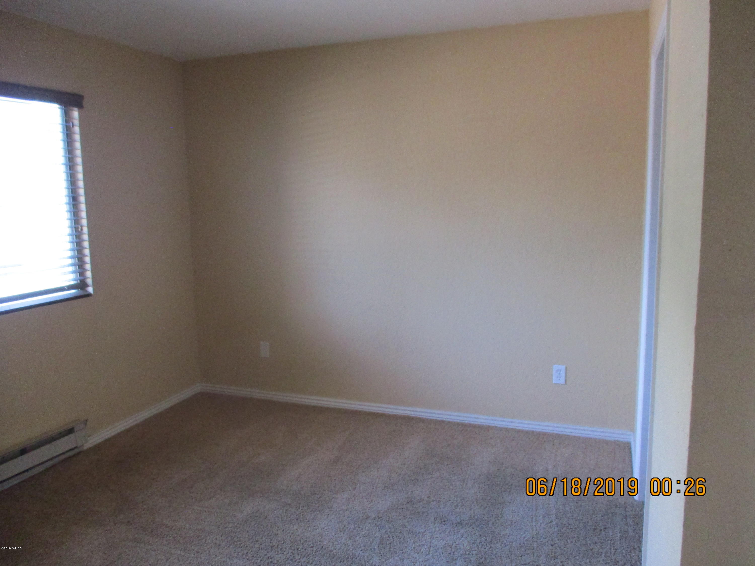 2700 South White Mountain Road, Unit 522 Show Low, AZ 85901 - Photo 4 of 8 a view of an empty room
