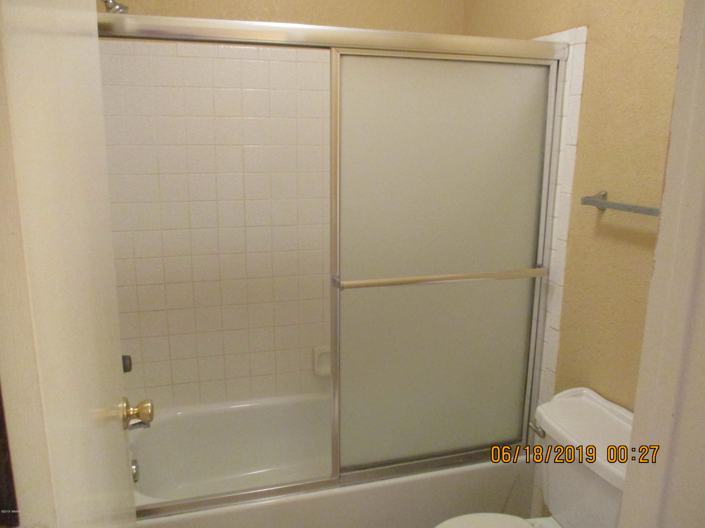 2700 South White Mountain Road, Unit 522 Show Low, AZ 85901 - Photo 6 of 8 a bathroom with a shower