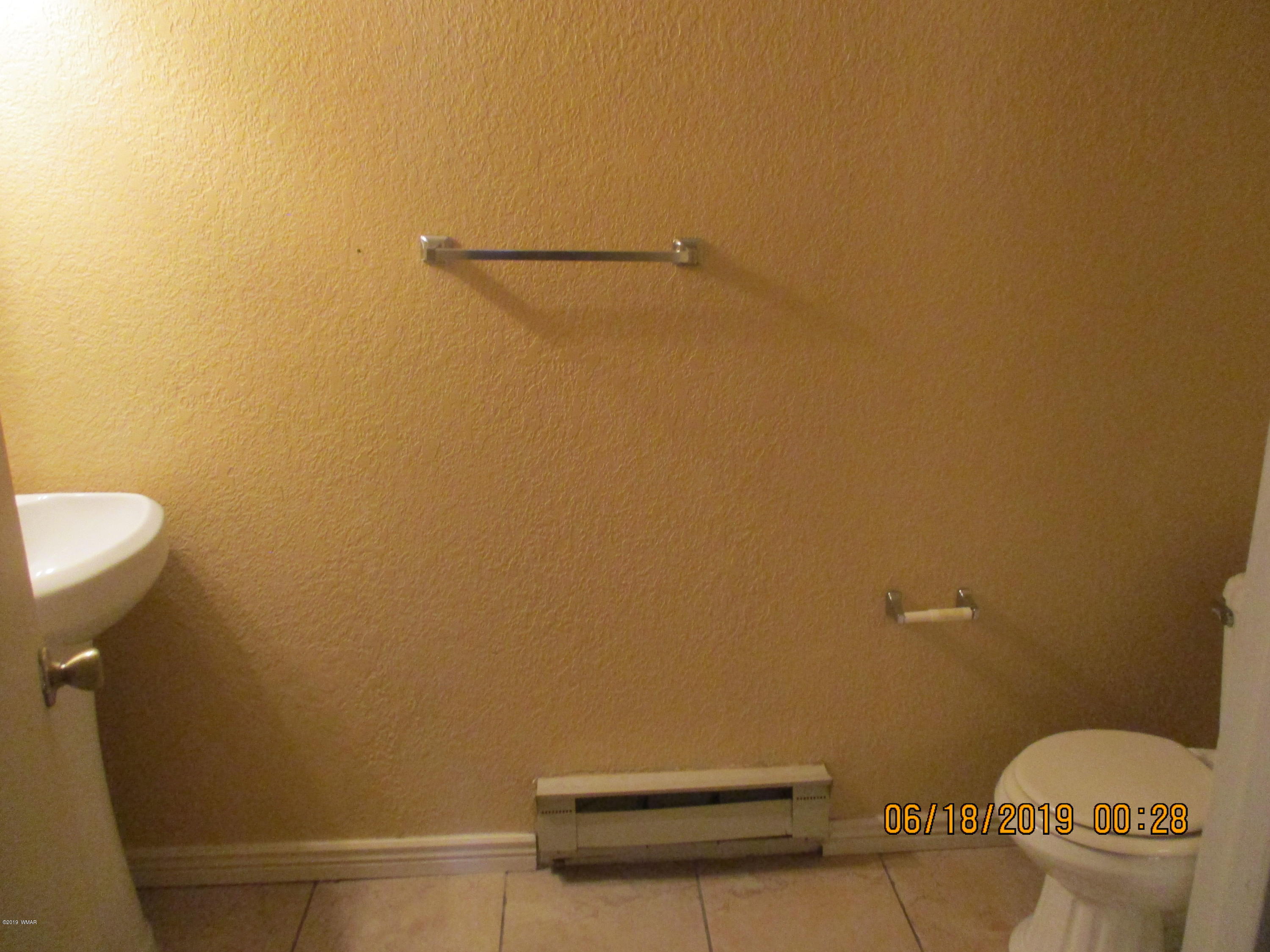 2700 South White Mountain Road, Unit 522 Show Low, AZ 85901 - Photo 8 of 8 a bathroom with a toilet and a sink