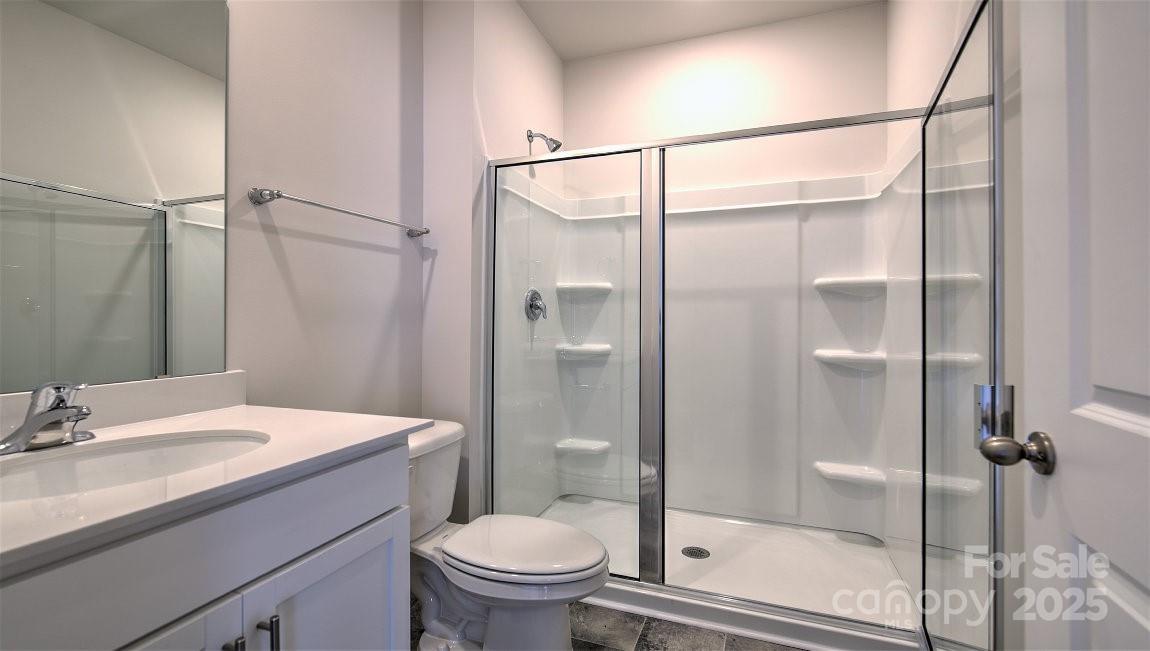 180 Salers Road Fletcher, NC 28732 - Photo 13 of 29 a bathroom with a sink toilet and shower